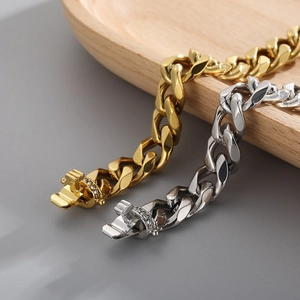 Men's gold and silver Cuban link bracelet with diamond-encrusted clasp closure