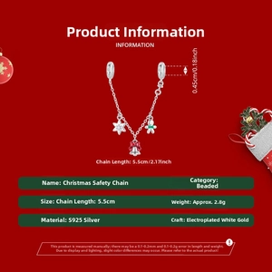 Detail of S925 sterling silver Christmas safety chain charm with gingerbread man and bell
