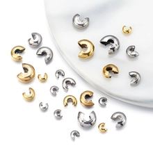 Detailed macro view of gold and silver stainless steel beads for DIY jewelry making
