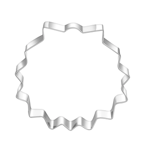 Close-up of food-grade stainless steel cookie cutter with round wavy gear shape