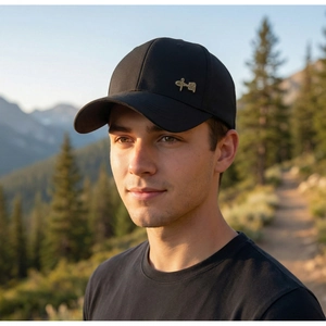 Detail of black baseball cap featuring golden Chinese calligraphy metal badge emblem