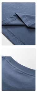 Detailed macro shot of blue cotton T-shirt stitching and ribbed crew neck finish