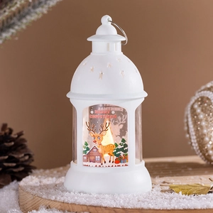 Detail of a white Christmas lantern with cartoon elk patterns and warm LED candle light