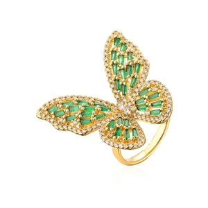 Detailed macro view of the butterfly ring featuring green zircons and gold-plated finish