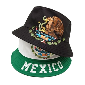 Black and white Mexico flag bucket hat featuring the eagle emblem and bold MEXICO text
