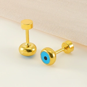 Detail of gold evil eye stud earrings with blue enamel and secure screw back closure