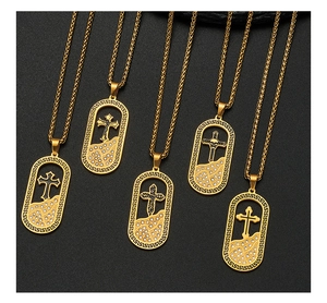 Macro shot of 18K gold plated cross pendants with crystals and twisted chains