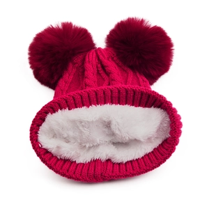 Red knit baby beanie with double faux fur pom-poms and warm white fleece lining