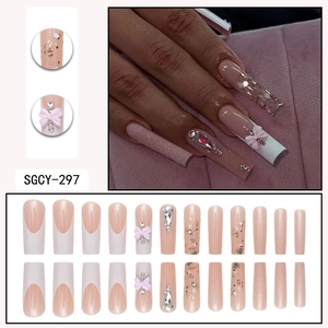 French tip false nails with pink bows, rhinestones and glitter sequins in long square shape