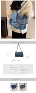 Detailed view of large vintage denim tote bag with chain strap and dimension markings