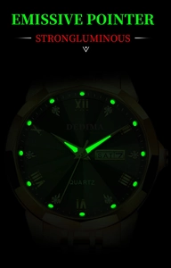 Close-up of green dial luxury men's watch with luminous markers and date display