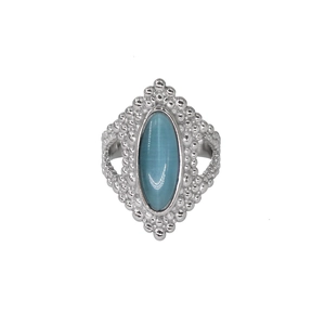 Vintage silver ring with oval blue cat eye stone and beaded texture on white background