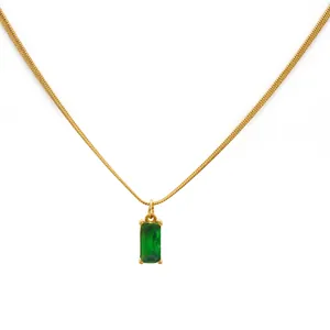 Detail of 18K gold snake chain necklace with a square green zircon pendant on white background