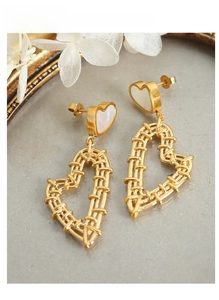 Detail of gold-plated woven heart earrings featuring white mother of pearl inlay accents