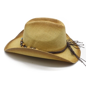 Tan woven straw cowboy hat with colorful wooden bead band and long tassel details