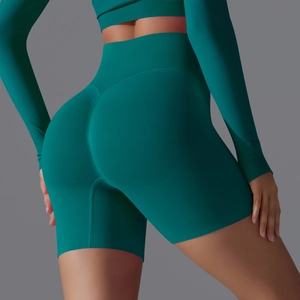 Close-up of scrunched butt detail on high waist seamless fitness shorts in dark teal