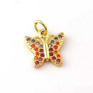 Detailed macro view of butterfly charm with colorful zircon stones in gold plating