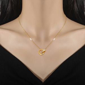 Minimalist gold titanium steel necklace with interlocking crystal double rings on model