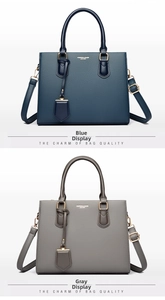 Detail view of blue and grey large capacity tote bags with pebble grain leather texture