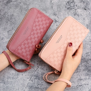 Elegant long double zipper wallet for women featuring floral embossed synthetic leather