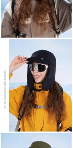 Close-up of black windproof winter trapper hat with ski goggles for outdoor sports