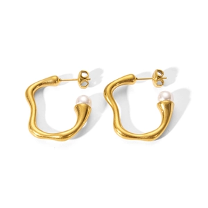 Detailed shot of irregular gold earrings with high-quality white pearl drop accents
