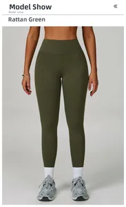 Detail of high waisted vine green yoga leggings showing seamless stretchy fabric fit