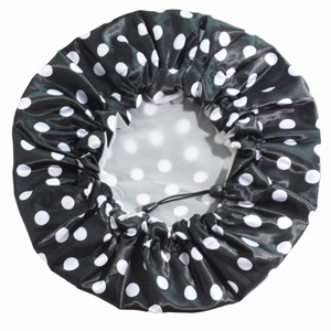 Detail of waterproof polka dot shower cap with adjustable elastic drawstring and PEVA lining