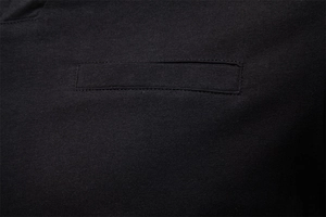 Macro shot of men's cotton long sleeve V-neck top showing black knit texture and pocket seams