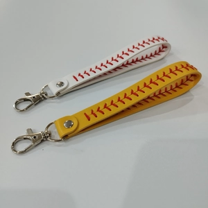 Detail of leather baseball wristlets with red stitching and silver metal lobster clasps