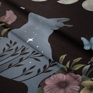 Close-up detail of soft microfiber fabric with floral and black cat tapestry patterns
