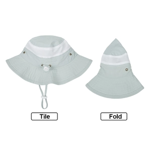 Detail of light green kids sun hat showing breathable mesh and foldable design