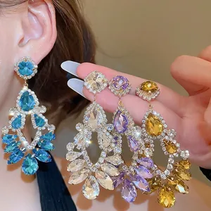 Sparkling geometric drop tassel earrings with rhinestones in blue, purple, and champagne