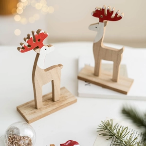 Nordic wooden reindeer desk ornament with red antlers and natural wood grain finish