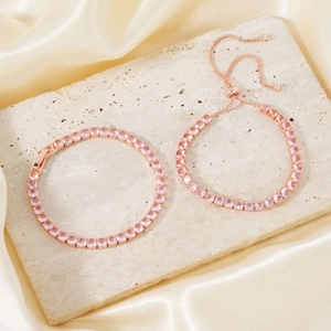 Two-piece set of rose gold bracelets with pink cubic zirconia and adjustable chain