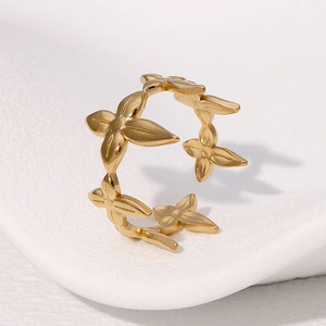 Golden stainless steel adjustable open ring featuring minimalist four-petal floral design