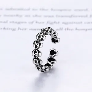 Vintage punk skull ring in antique silver finish with adjustable open band design