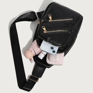 Black pebbled leather crossbody chest bag for women showing large capacity for daily items
