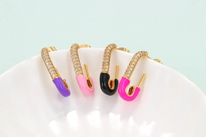 Colorful safety pin earrings with gold plating and cubic zirconia in four vibrant colors