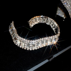 Macro shot of high-clarity rhinestones set in multi-row silver alloy choker necklace