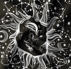 Detailed texture of black and white sun moon mandala tapestry with soft fabric folds