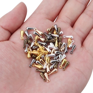 Waterdrop alloy extension chain pendants in assorted metal finishes held in a palm