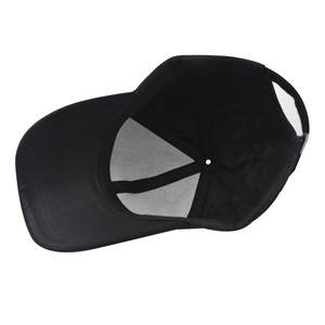 Detail view of the black baseball cap showing interior sweatband and metal buckle closure