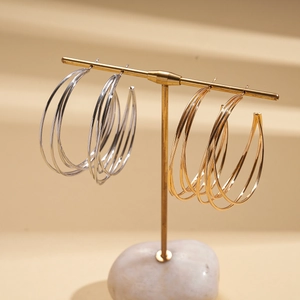 Multi-layer geometric C-shaped hoop earrings in polished gold and silver metal finishes