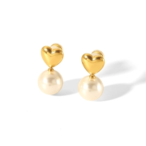 French vintage style heart gold earrings with round pearls on a white background