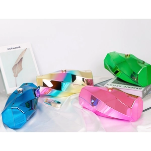 Minimalist geometric acrylic box clutch in multi-color metallic finish on white silk