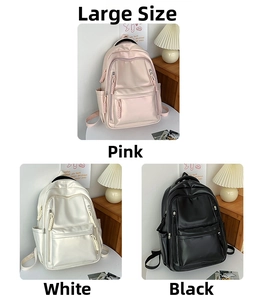 Three large minimalist backpacks in pink, white, and black with shiny waterproof texture