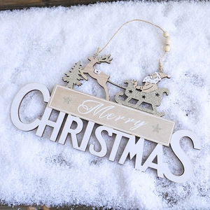 Macro detail of Merry Christmas wooden hanging sign with rustic beads and hemp rope