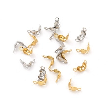 Detailed view of stainless steel hollow ocean pendants in gold and silver for DIY jewelry