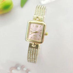 Luxury gold bangle watch for women with pink square dial and sparkling rhinestones